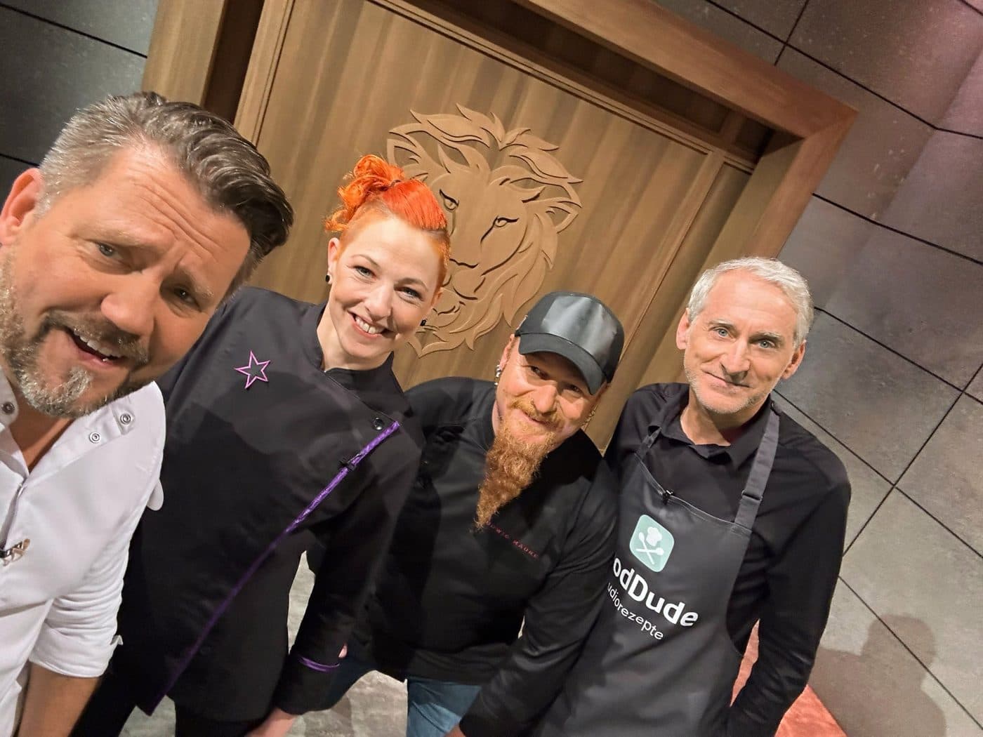 Group photo in front of the lions' den door